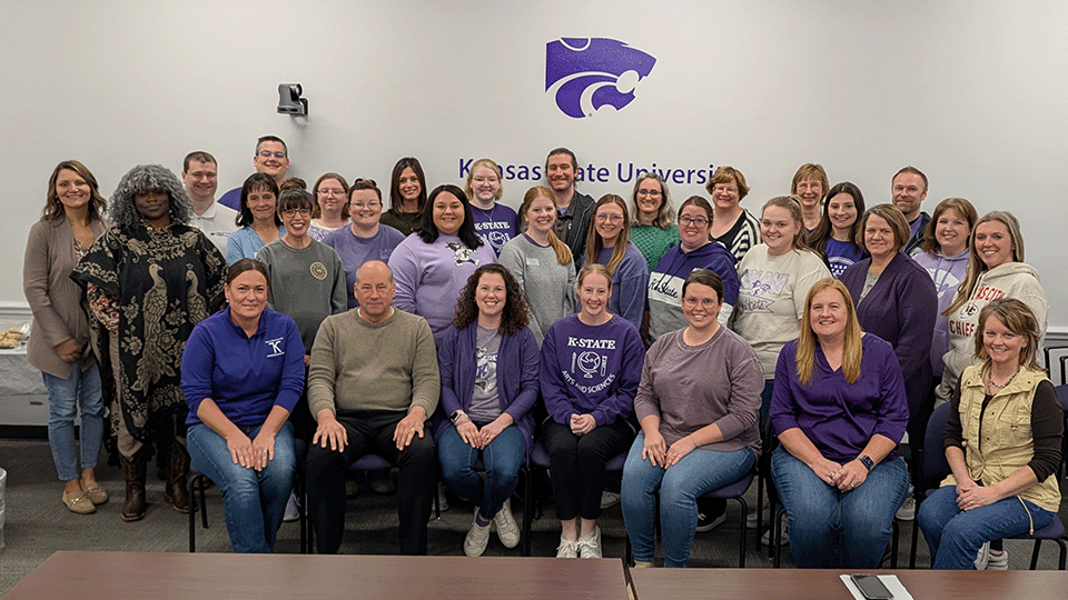 Members of the Advisor Forum smile for the camera during a meeting