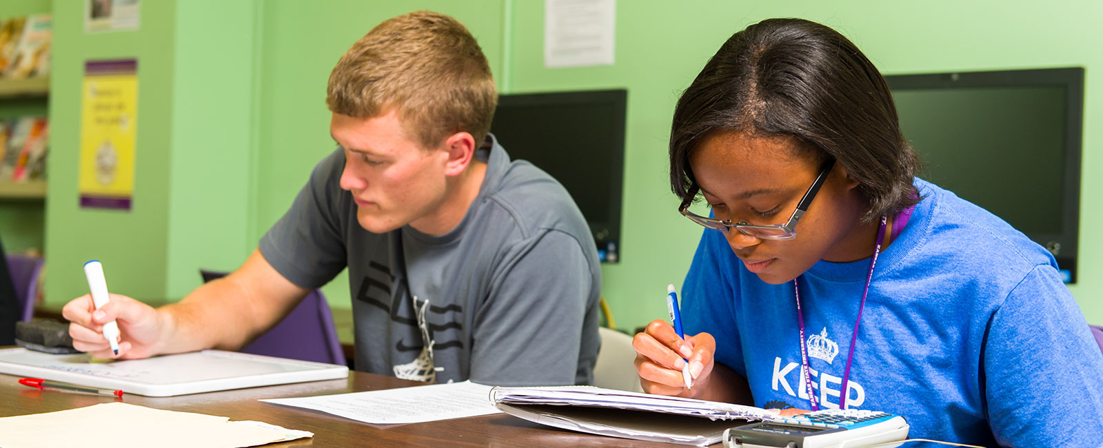 Secondary education students working in class