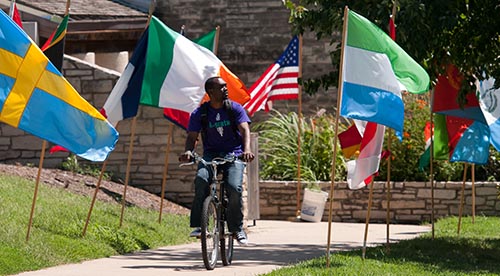 Student biking near International Student Center