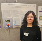 Elizabeth Morillo standing by her poster.