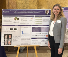 Lauren Apprill beside her poster at the Capital.