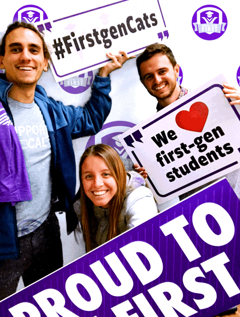 Students holding "Proud to be First" signs.