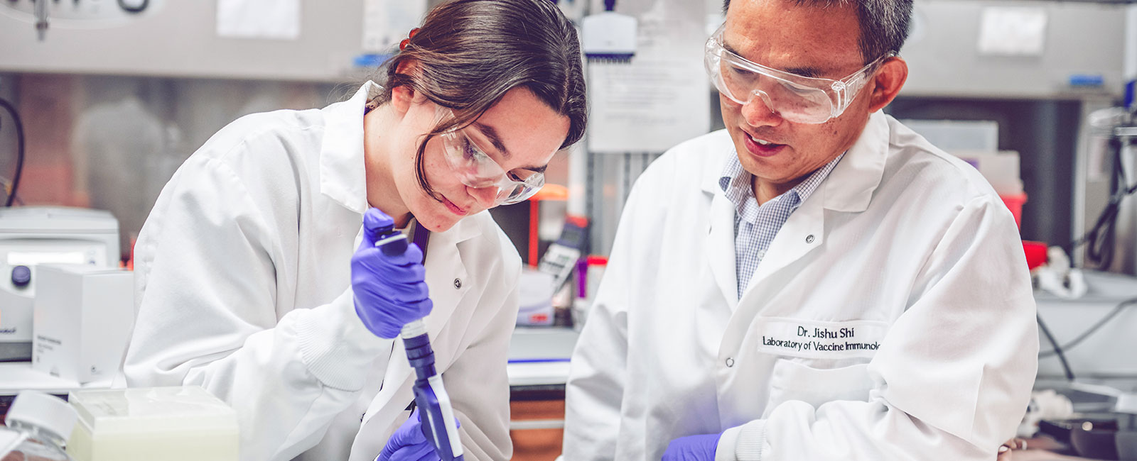 Dr. Jishu Shi and researcher in the Laboratory of Vaccine Immunology