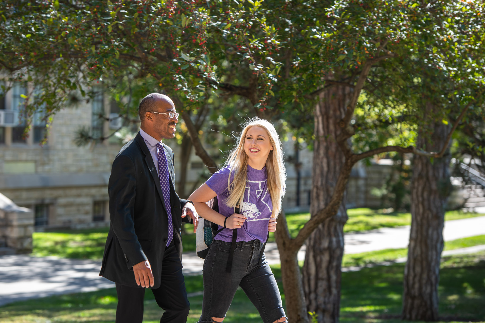Student and professor talking and walking near Willard Hall