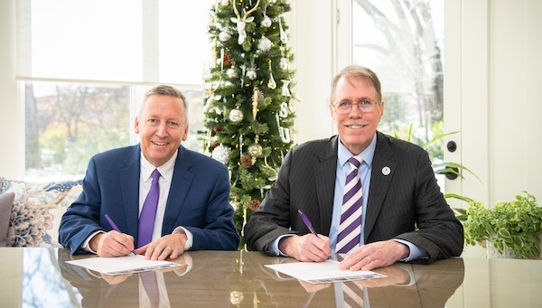 Linton and Taber signing the adoption