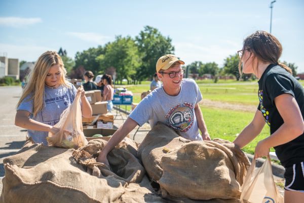 Students volunteer at a mobile food distribution