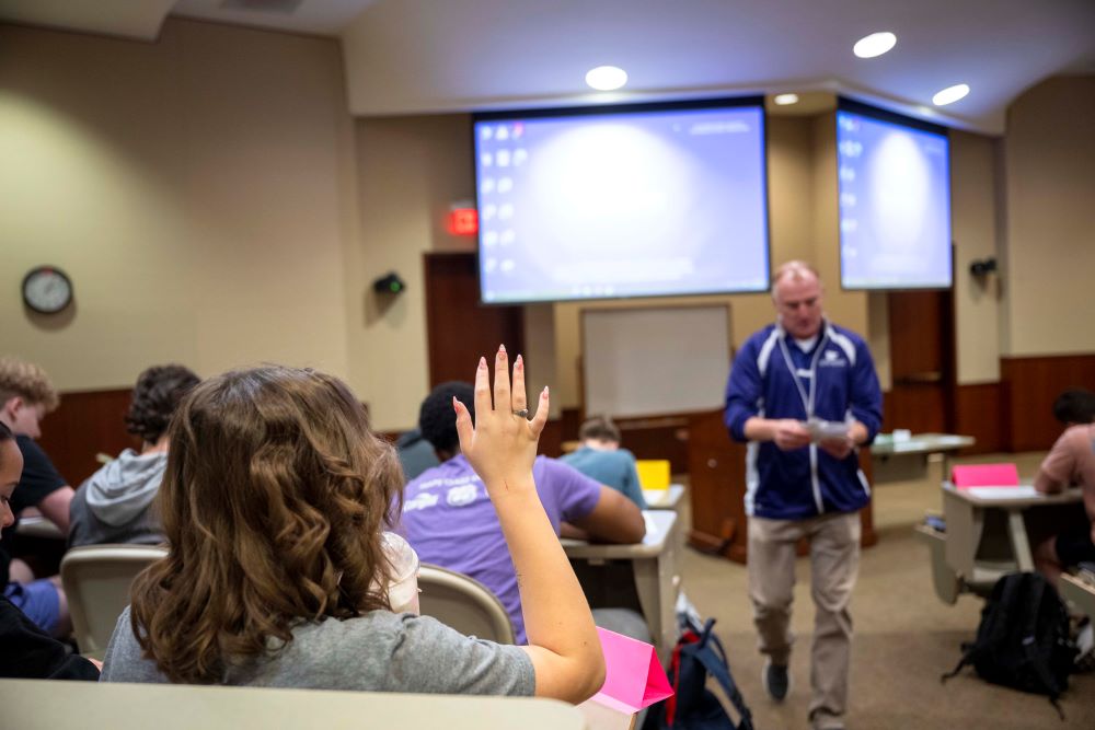 Student raises hand in Town Hall