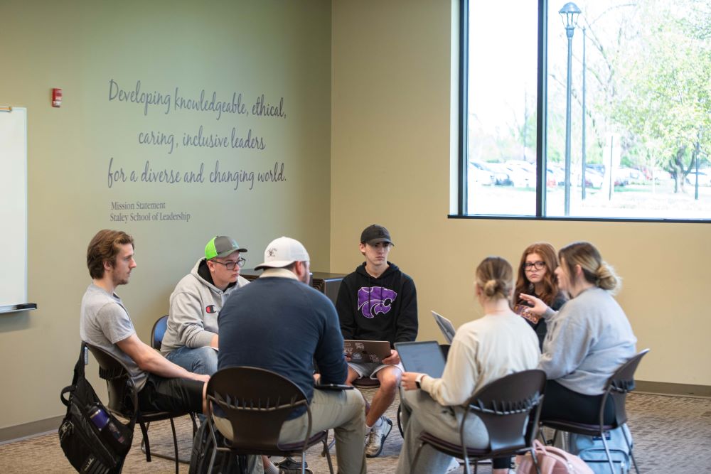 Students seated in circle for Learning Community