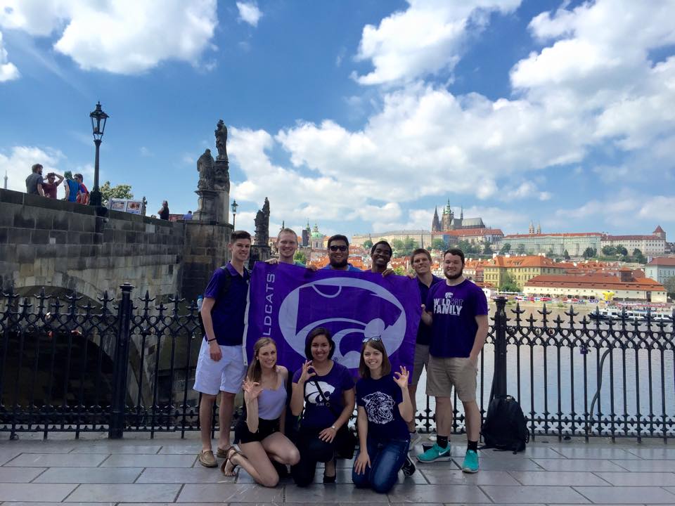 students in Prague with K-State flag