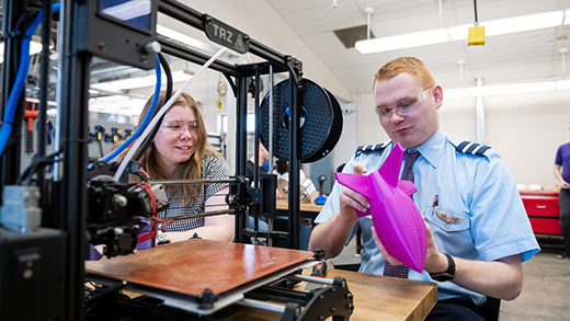 Students at a 3D printer