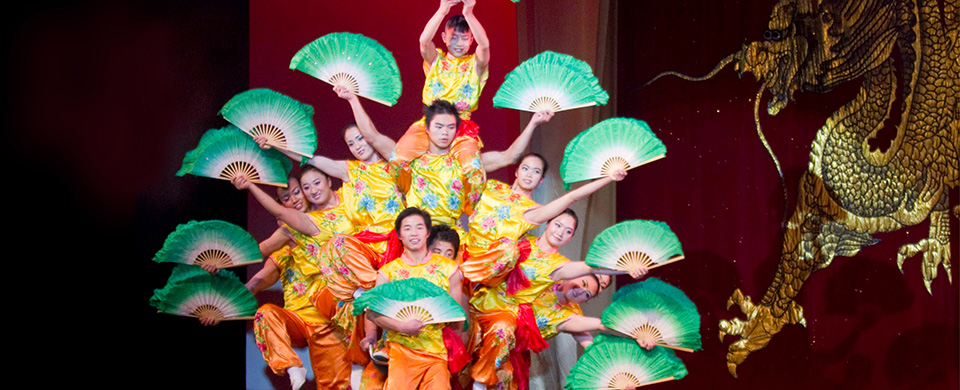 Peking Acrobats hold a pose on stage