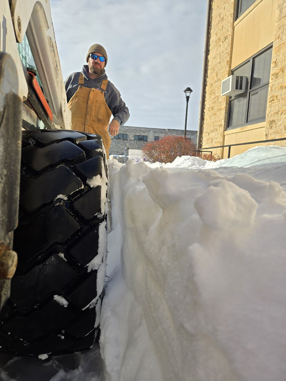 Steve Snyder, landscape superintendent, clears snow.