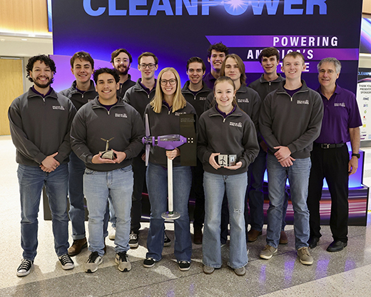 Members of the 2024 Wildcat Wind Power pose with their awards after taking third at the 2024 Collegiate Wind Competition. From left to right, back row: Sidney Wagner, Jacob Lowe and Cameron Million. Middle row: Nick Saia, Kent Deterding, Jakob Long, Joseph Lilley and advisor Don Gruenbacher. Front row: Jose Rodriguez-Millan, Israel Barraza, Rebecca Semple, Macie Sexten and David Pierson.