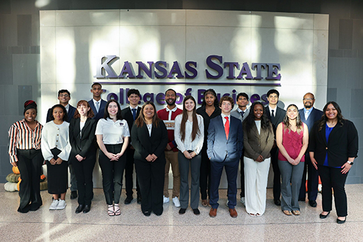 A group of students standing in two rows