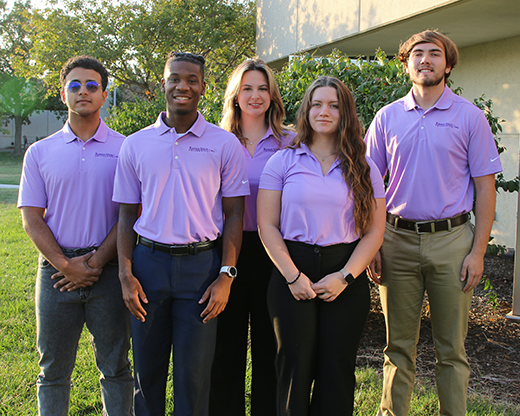 A group of students in lavender polos.