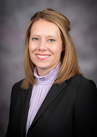 A-woman-in-a-light-purple-shirt-and-black-blazer