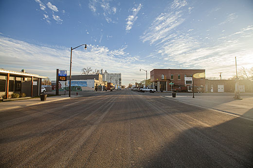 This photo shows the main street in Courtland, Kansas at sunset. 