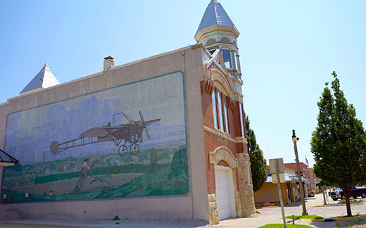 This photo shows a mural on the Kingman County Historical Museum in downtown Kingman, Kansas. 