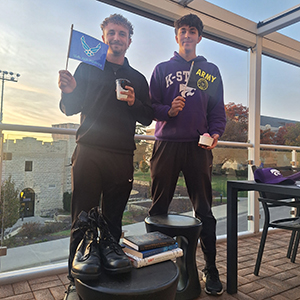 Two college students pose for a photo. 