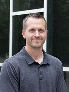 Steven Copp smiles for a portrait