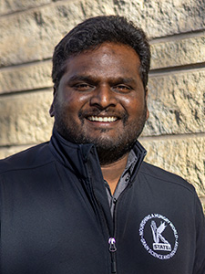 Kalimaresh Siliveru smiles for a professional portrait. 