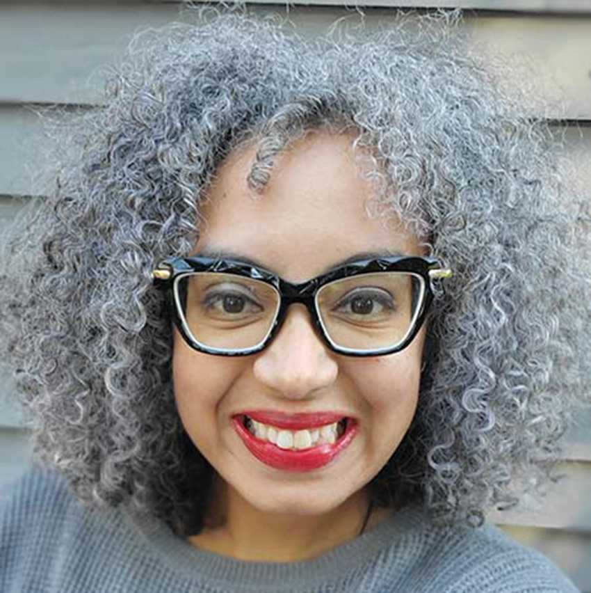 Tara Coleman smiles for a portrait.