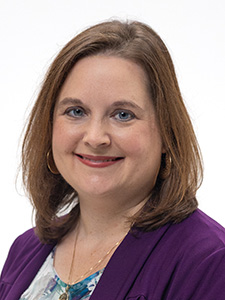 Melissa Holmes smiles for a portrait. 