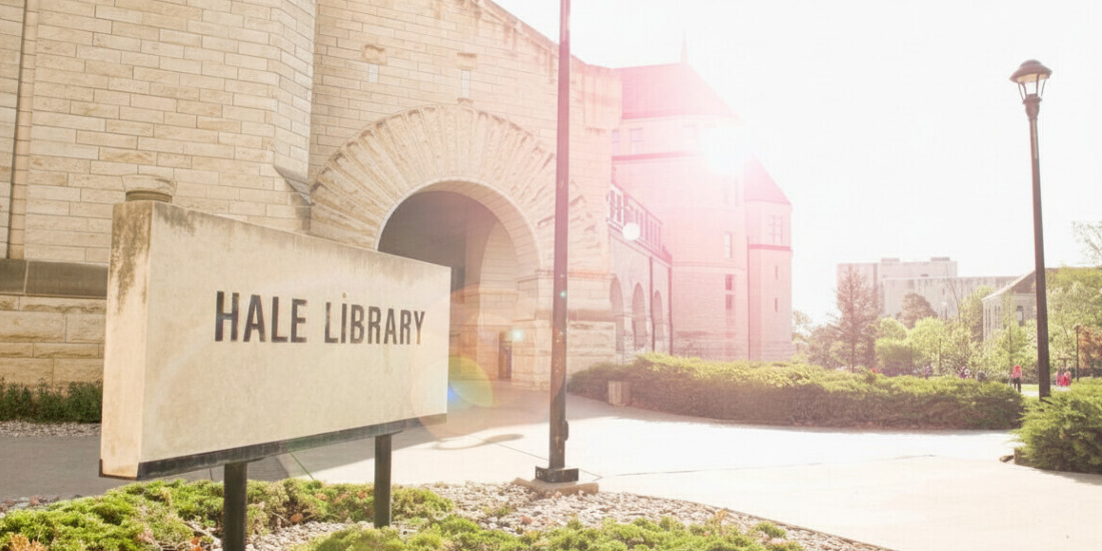 The outside front of Hale Library. There is a limestone sign in the bottom left corner displaying the building's name.