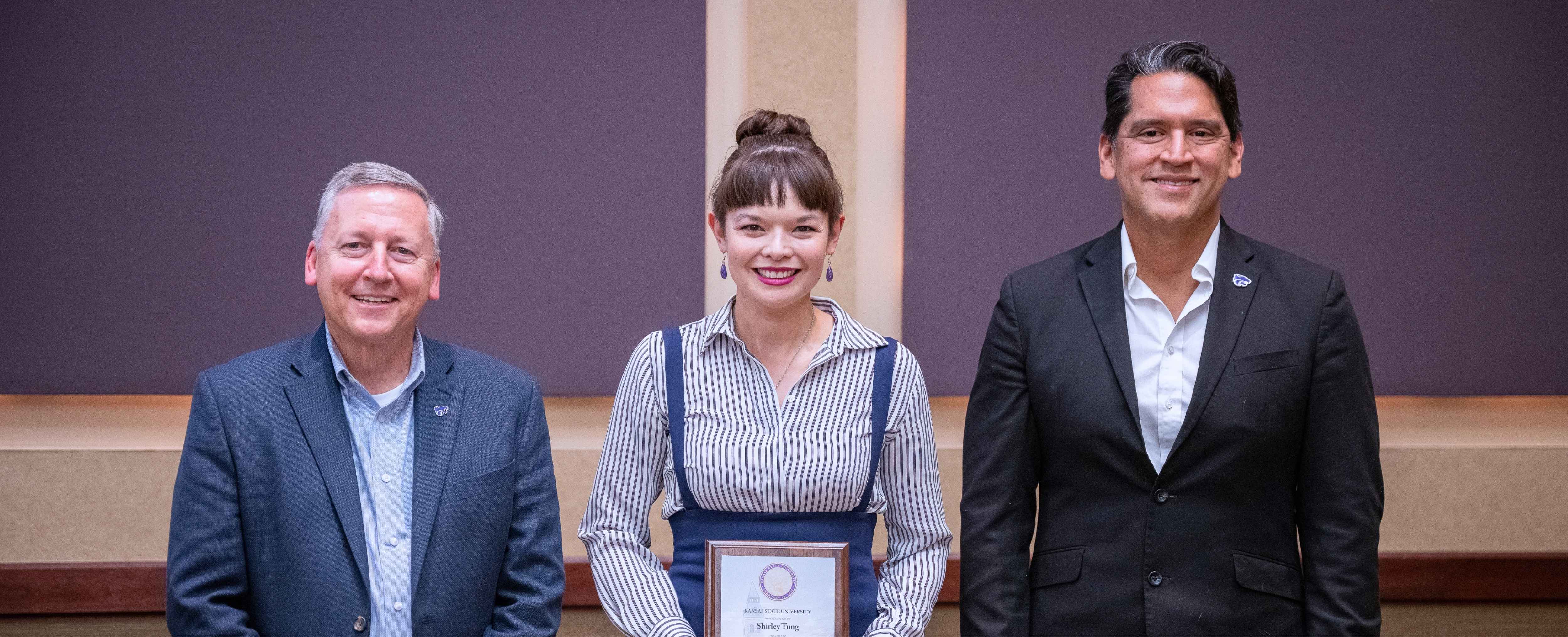 Shirley Tung poses with president Richard Linton and provost Jesse Perez Mendez during K-State's 2025 University Outstanding Scholars ceremony.
