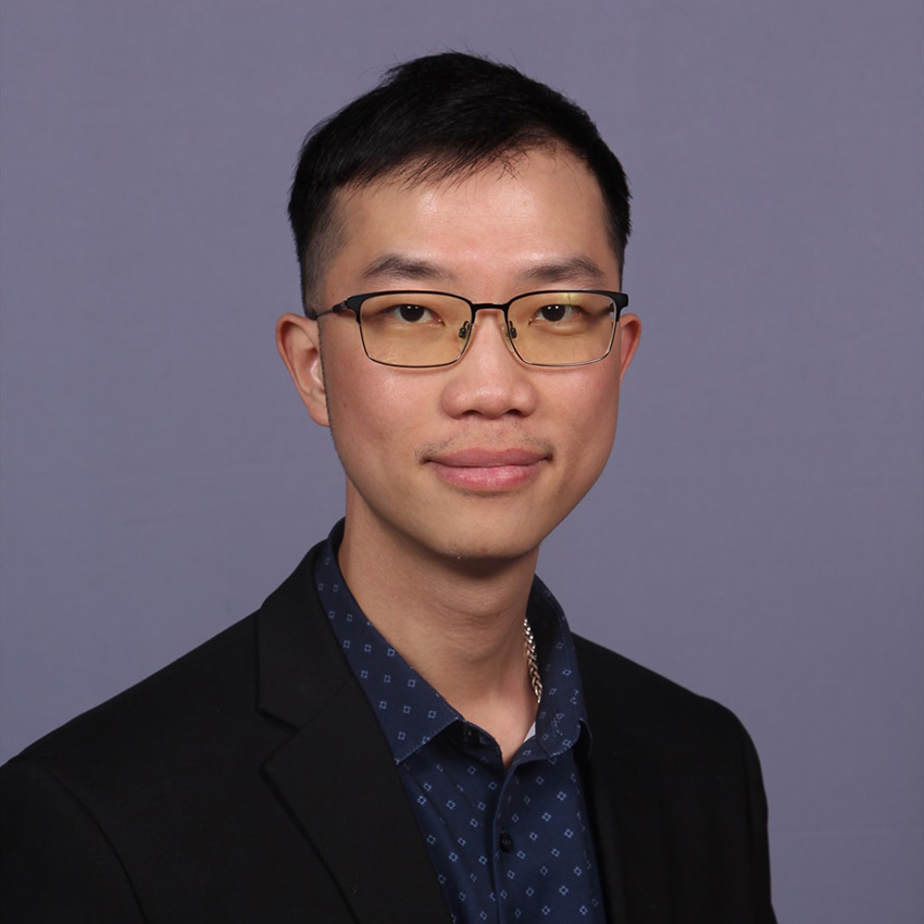 Chanh Bao Lam smiles for a professional portrait. 