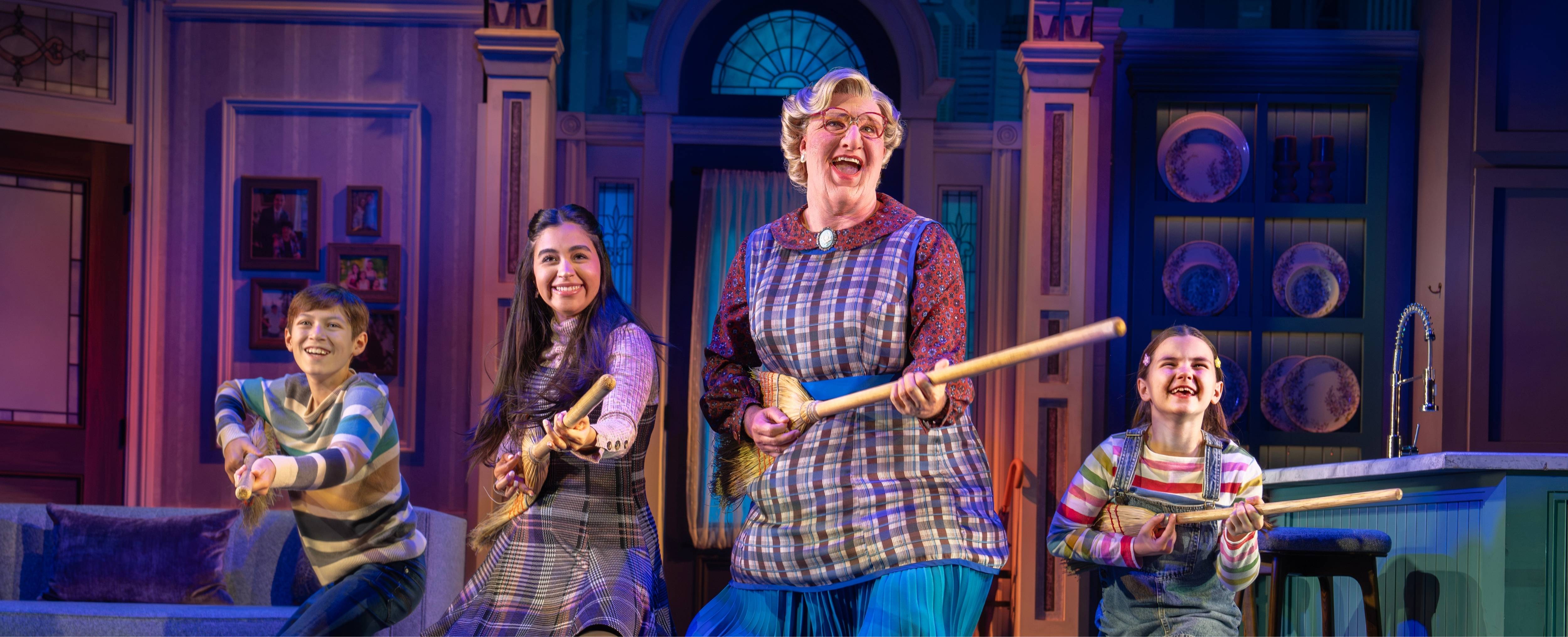 Actors from "Mrs. Doubtfire" sing and dance on stage.