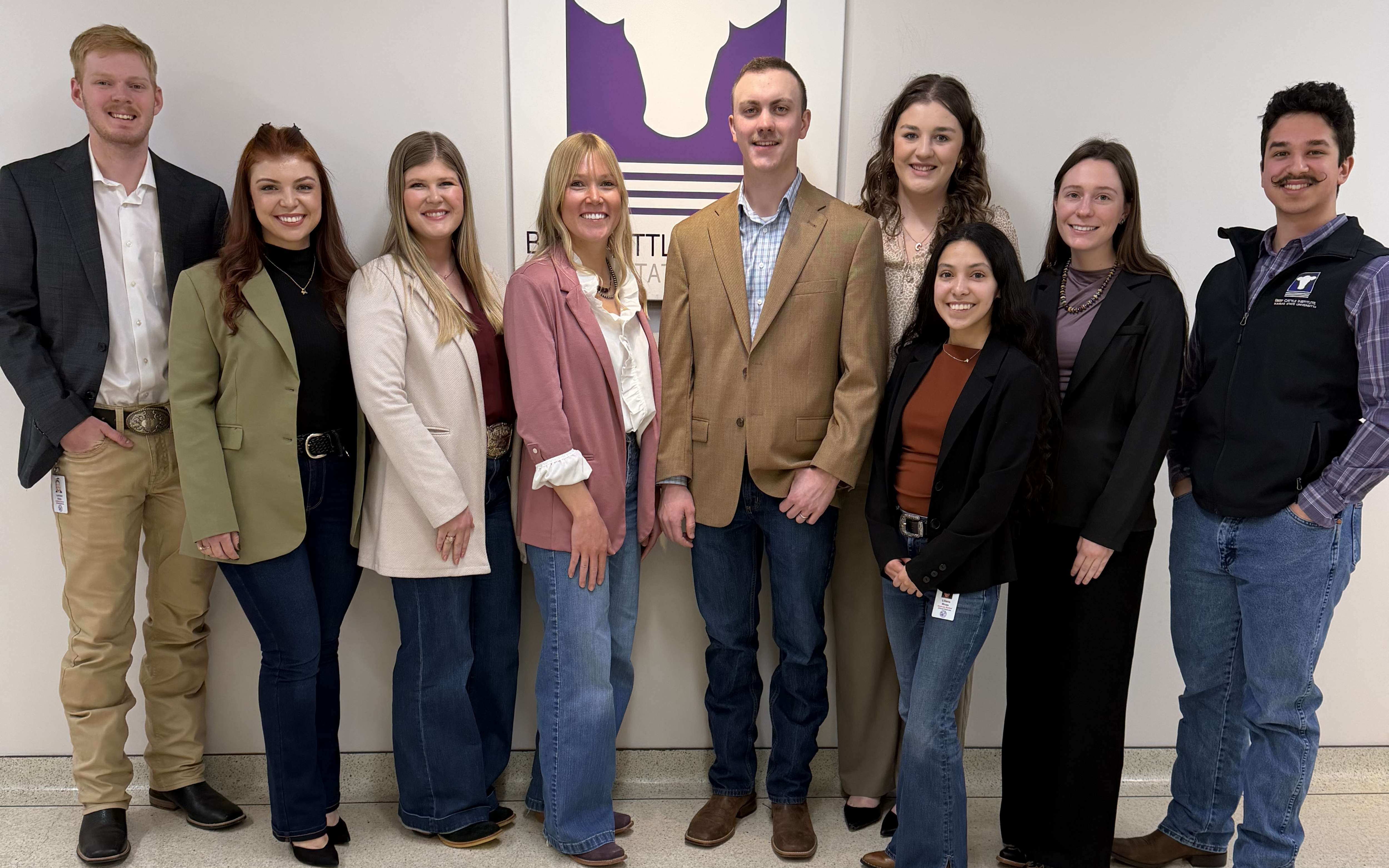 Wingert and her eight other graduate research assistant peers pose together for a photo.