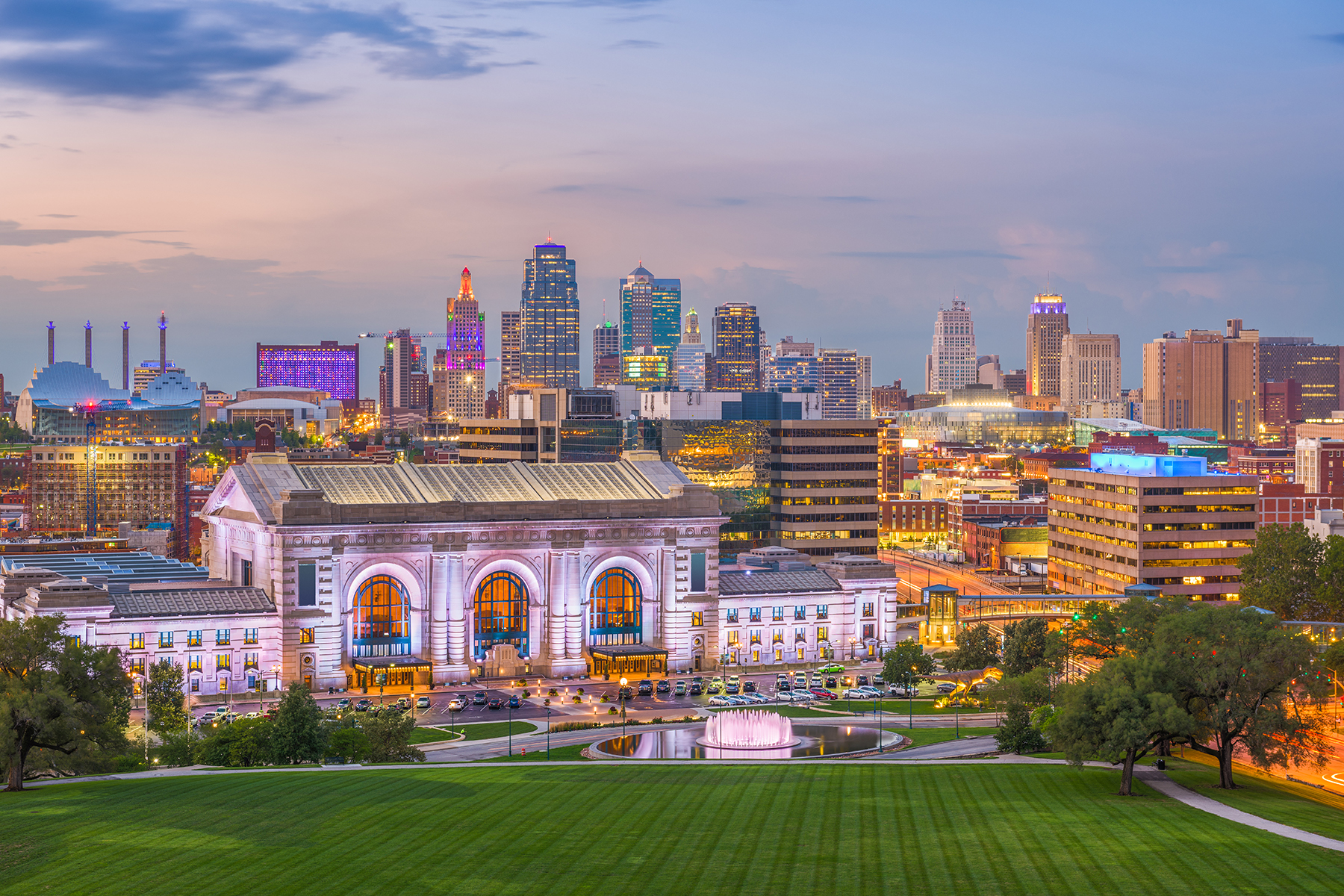 A wide angle shot shows the vivid urban skyline of Kansas City's downtown.