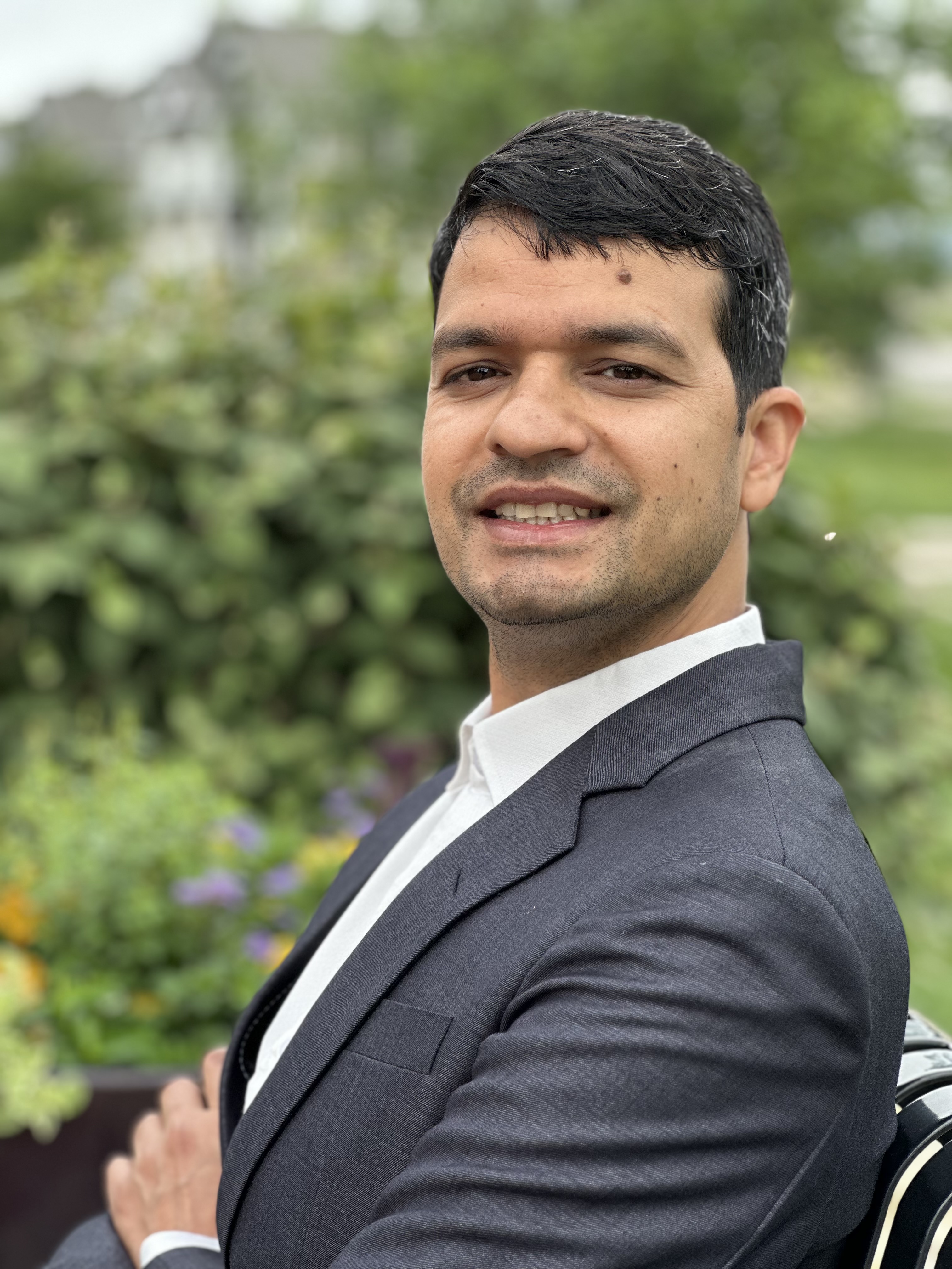 Prabhu smiles for a portrait 