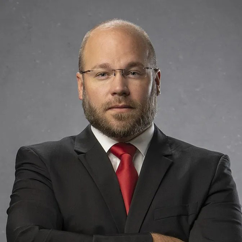 Steve Bellinger smiles for a professional portrait. 