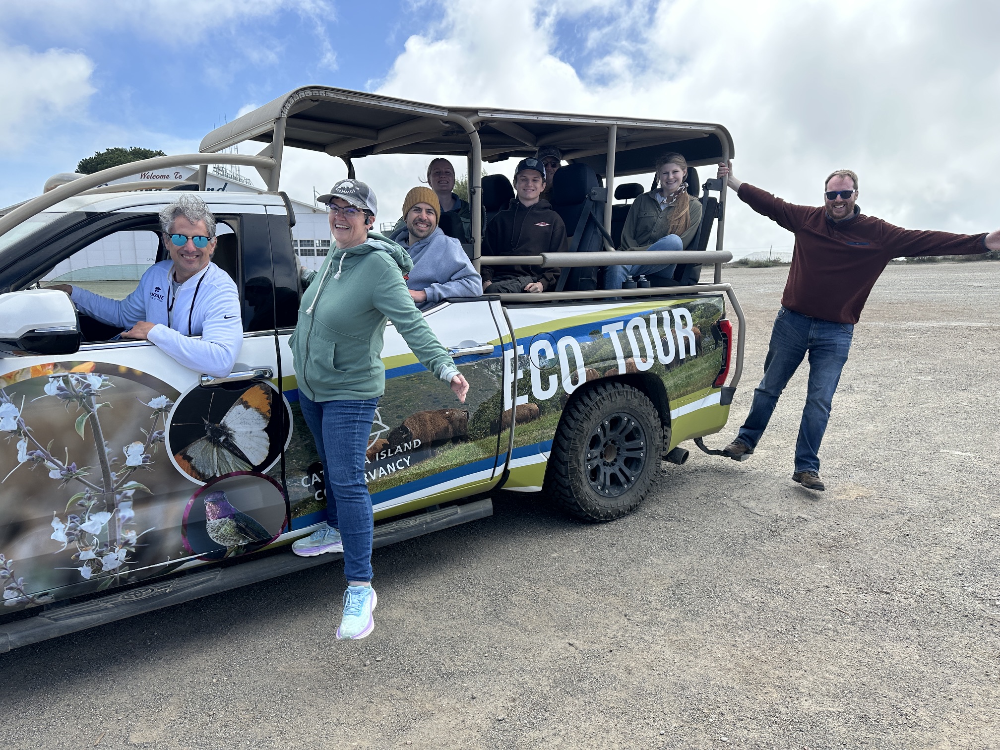 Justin Kastner, colleagues and students pose in a stuck during an ecological tour throughout California