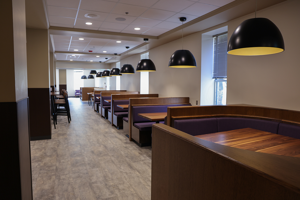 Dining center seating is shown, including booths with lamps overhead