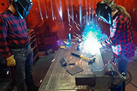 Students in Kansas State University's Net Positive Studio work on assembling the zero energy home in St. John.
