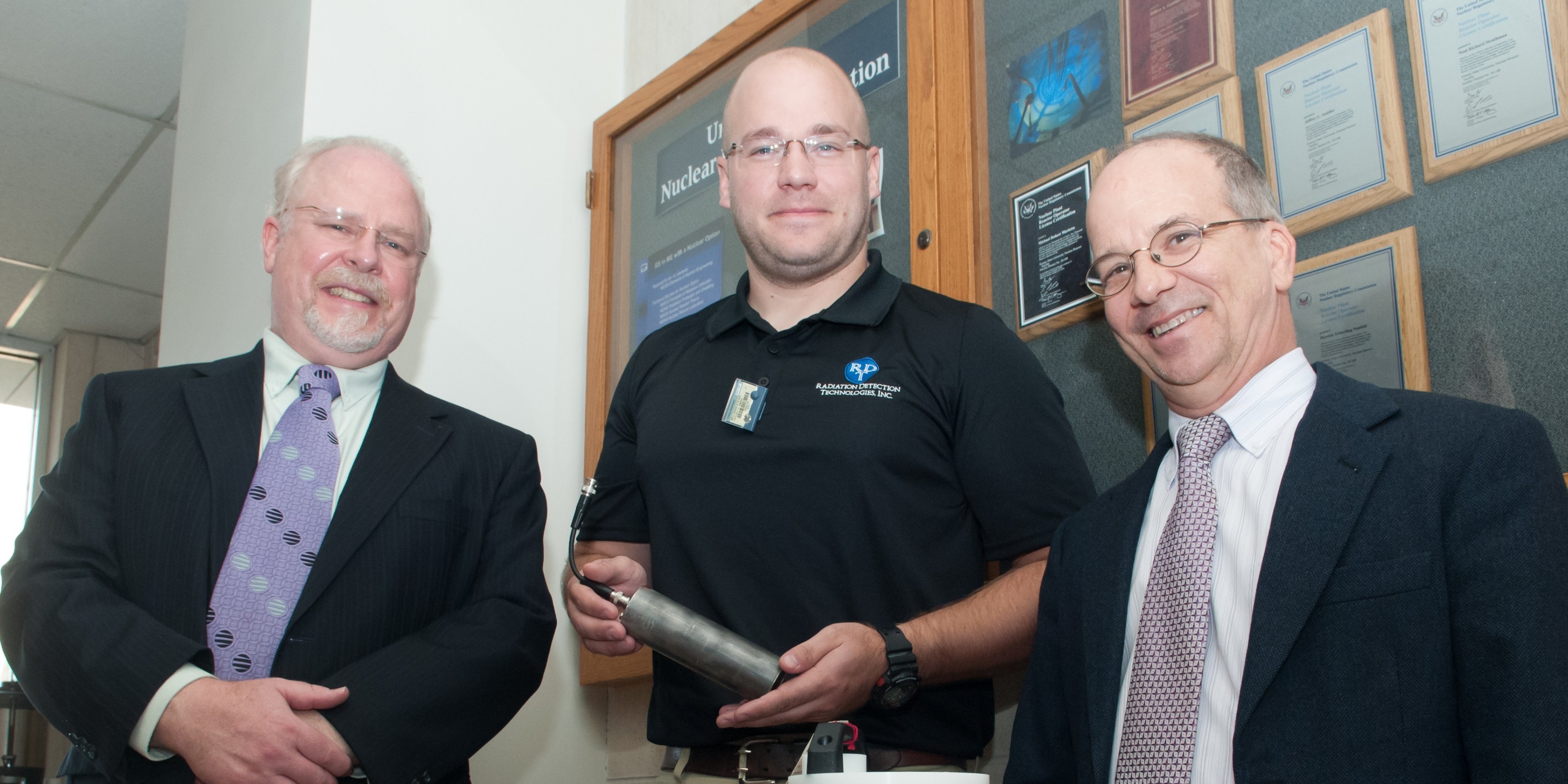 (From left): Philip Ugorowski, Kansas State University research assistant professor of mechanical and nuclear engineering; Steven Bellinger, founder and president of Radiation Detection Technologies Inc.; and Douglas McGregor, professor of nuclear engineering, stand next to neutron detectors.