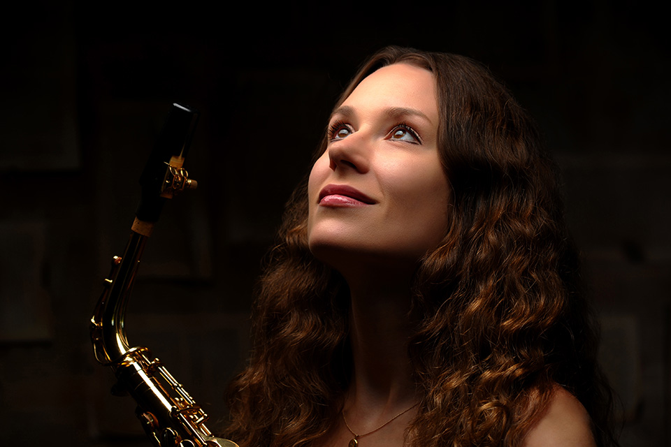 Anna Marie Wytko poses with a saxaphone for a portrait.