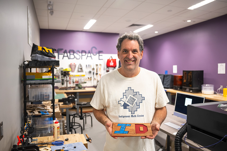 David Auckly smiles for a portrait.