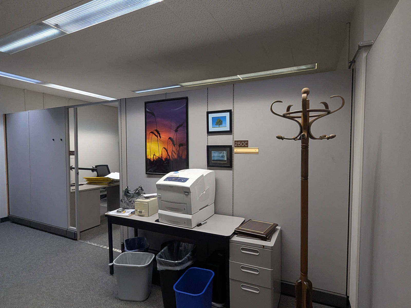 A set of surplus office furniture sits in an empty office.