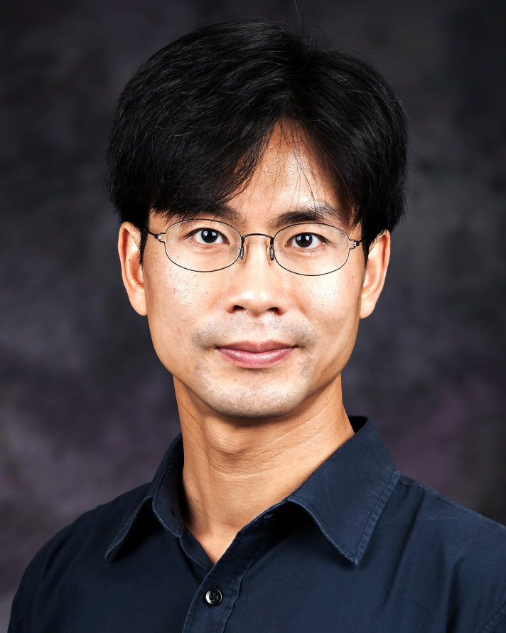 Jin Lee smiles for a portrait.