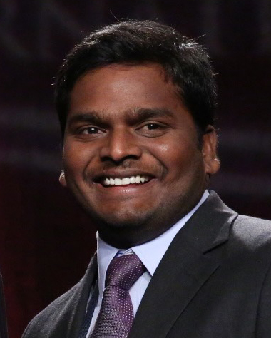 Kaliramesh Siliveru smiles for a portrait.