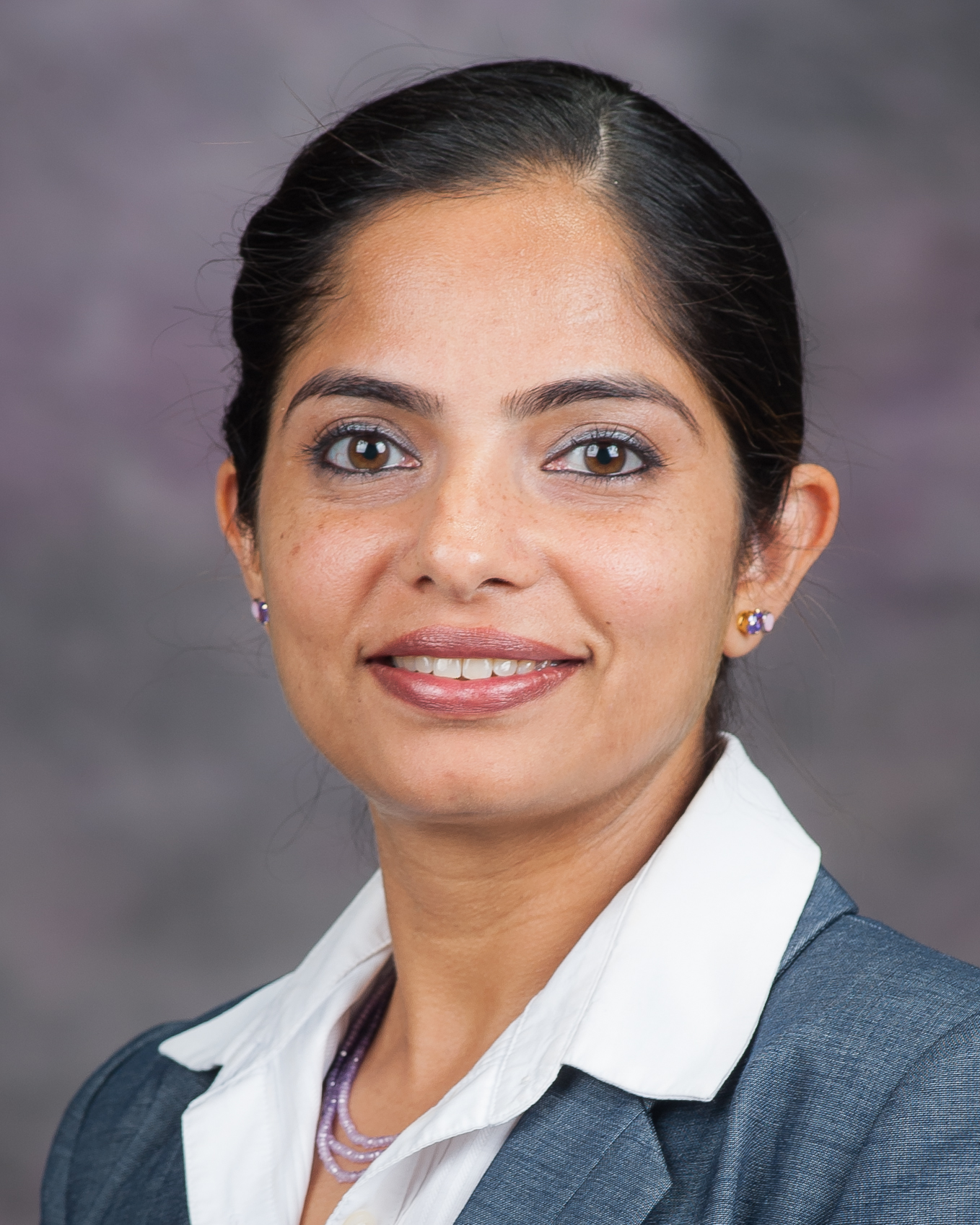 Vaishali Sharda smiles for a portrait.