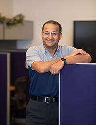 Bala Natarajan a-man-in-a-gray-and-blue-polo