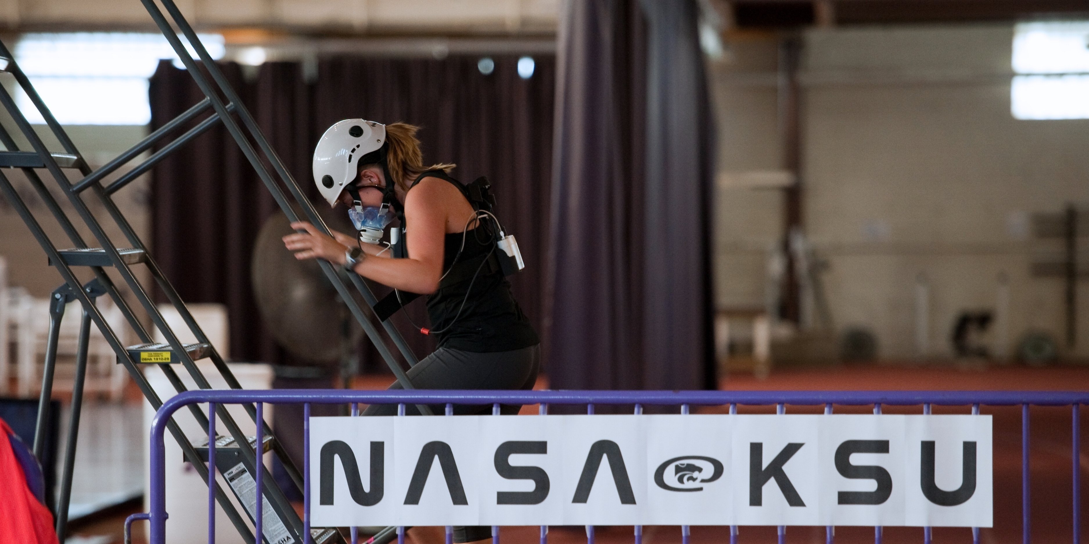 Carissa Rogers, senior in kinesiology and pre-dentistry, Fredonia, runs down a set of stairs as part of a research obstacle course that simulates lunar tasks.