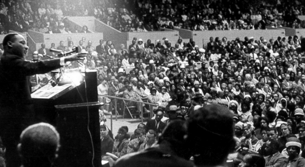 MLK Jr. speaks to a crowd of people.