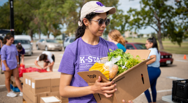 A student works at a food drive.