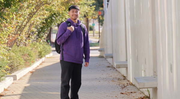 A student walks on campus.